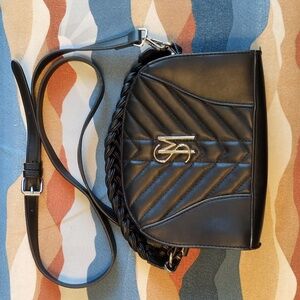 Steve Madden BHardyy quilted crossbody bag with a braided top handle.